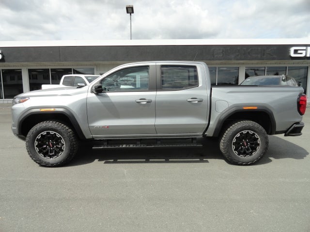 2026 GMC Canyon AT4 in Sterling Metallic — front three-quarter view